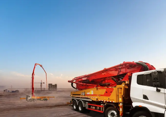 SANY concrete boom pump truck delivering concrete on a UAE construction project. Robust and reliable concrete pumping solutions available from UMHE.